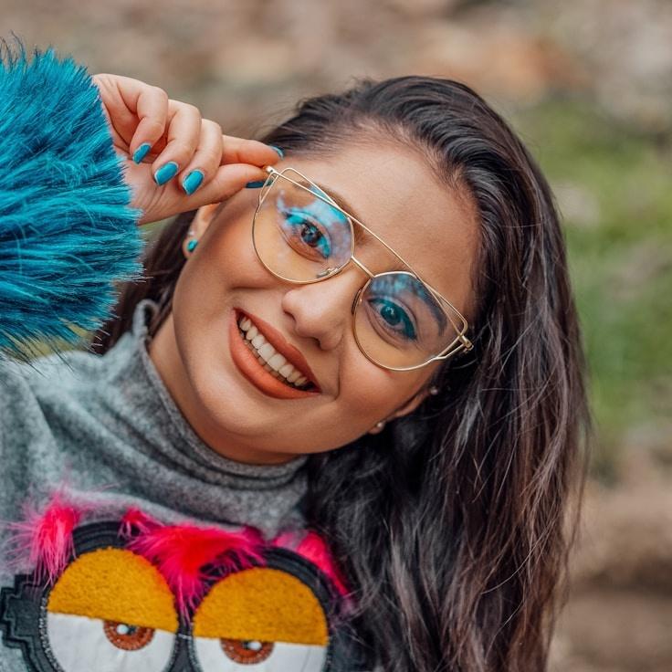 Alex Morgan, Lead Design Curator at GlowForgePlain, reviewing corporate floral arrangements